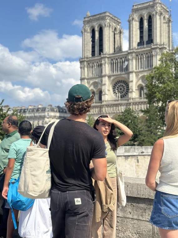 Guests looking towards Notre-Dame on a sunny day