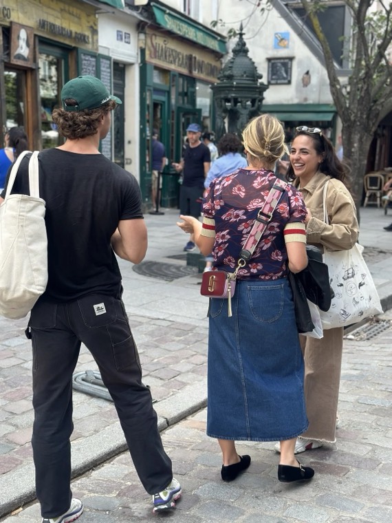 Guests walking along a cobbled Paris street